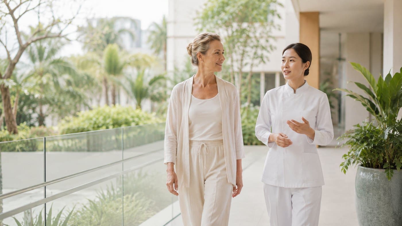 A coordinator accompanying a patient on the clinic grounds